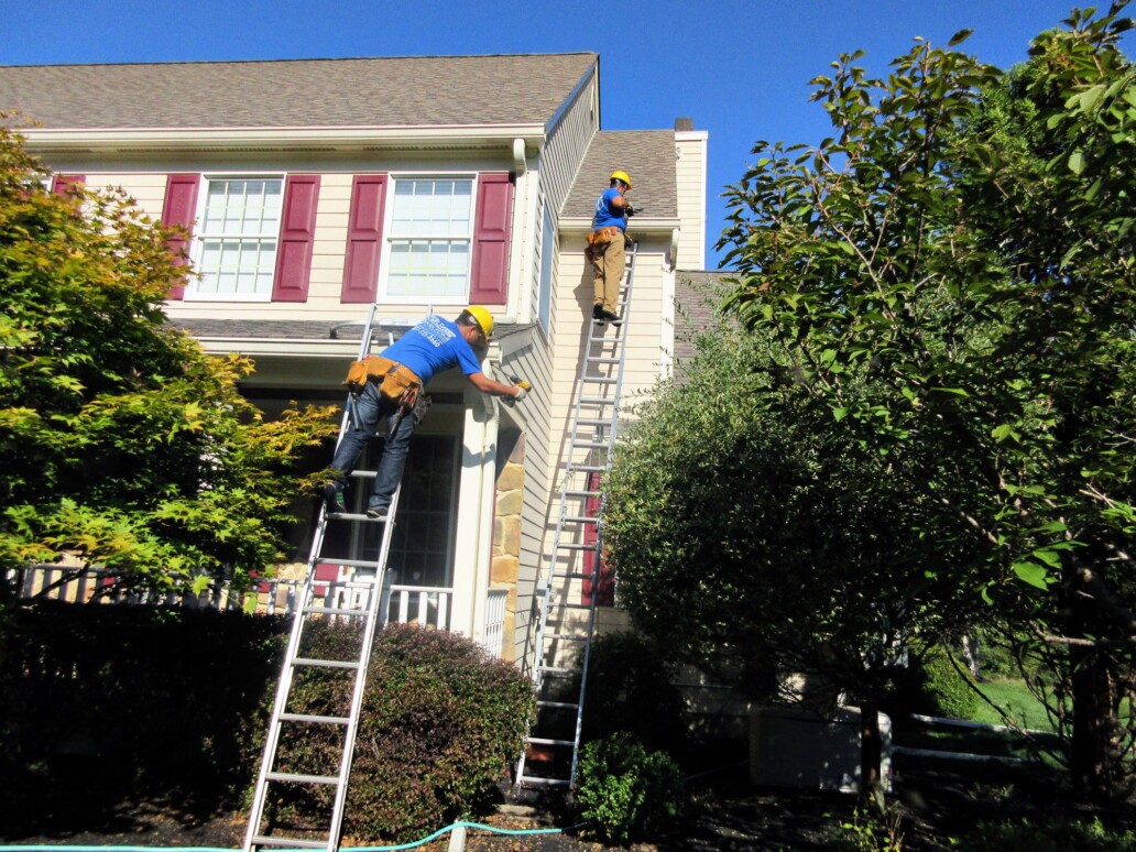 repairing-the-downspout-and-checking-to-ensure-the-gutter-is-secure